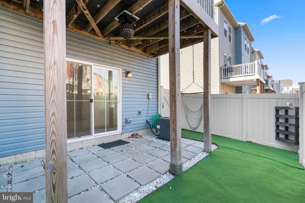 a view of a backyard with a table and chairs