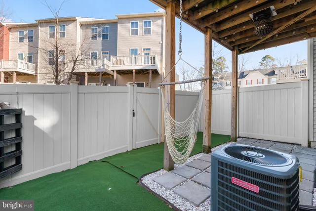 a swimming pool with outdoor seating and yard