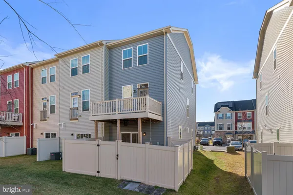 a view of swimming pool with outdoor seating and city view