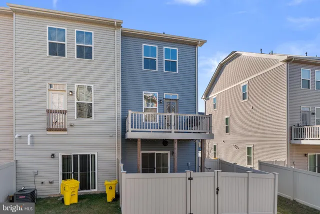 a front view of a house with swimming pool and a yard