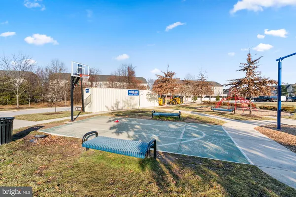 a view of a hall way with furniture