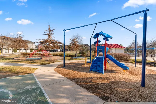 a view of a swimming pool and lounge chairs