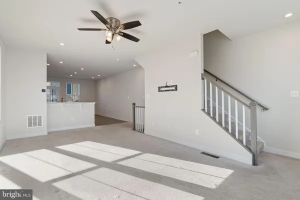 a view of a livingroom with a ceiling fan