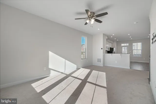 a view of kitchen with cabinets and wooden floor