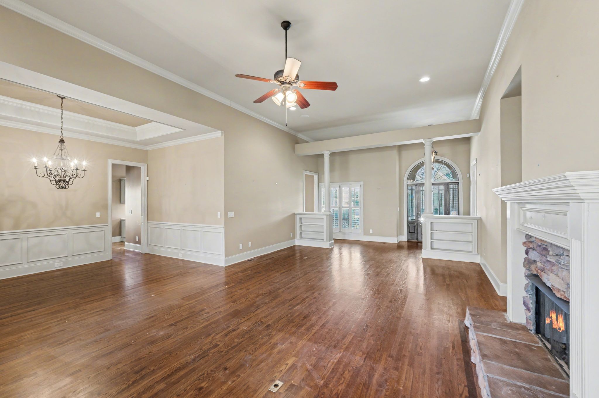 405 Luna Court Franklin, TN 37064 - Photo 16 of 57 a view of a livingroom with wooden floor a ceiling fan and windows