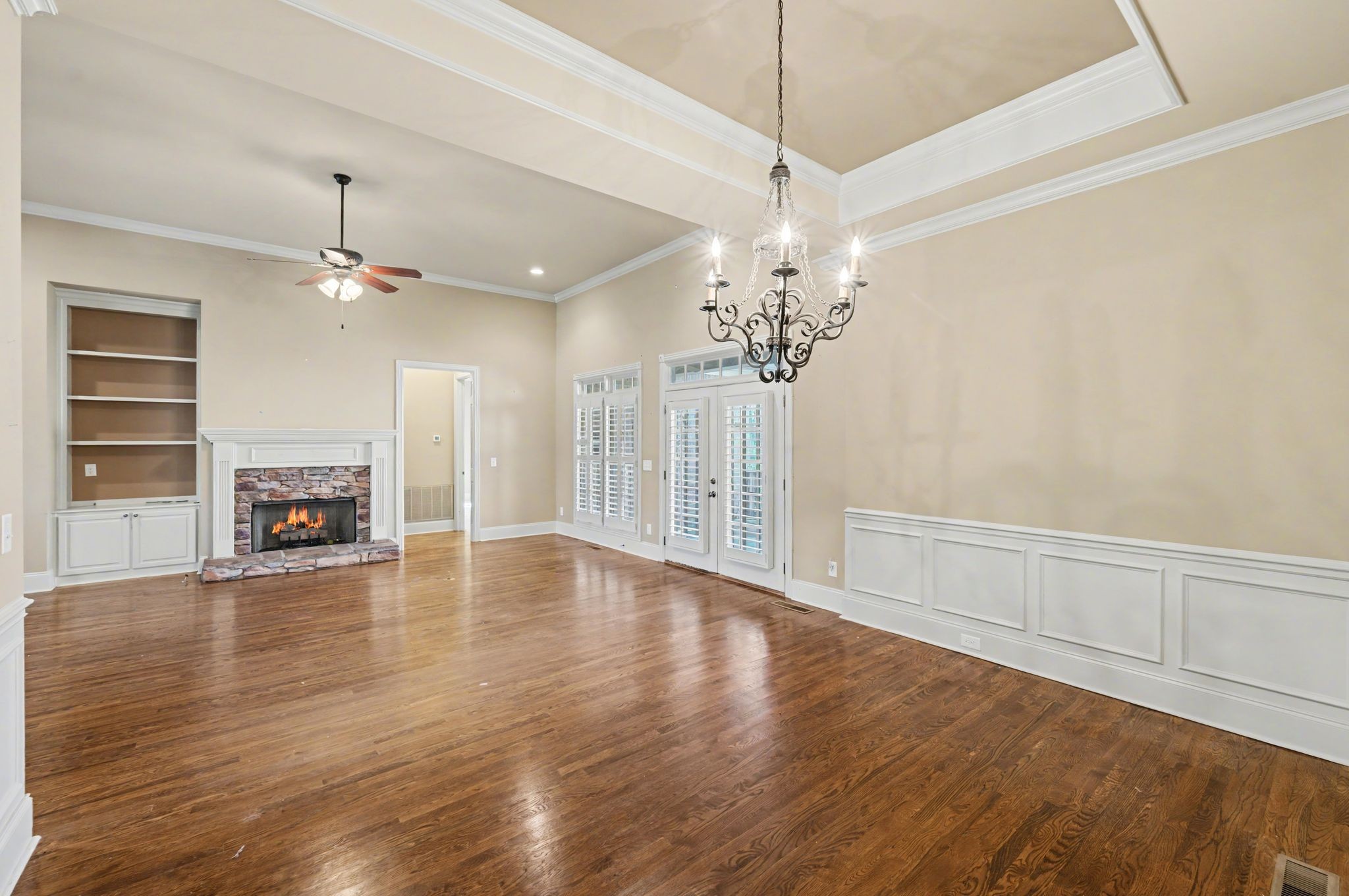 405 Luna Court Franklin, TN 37064 - Photo 19 of 57 a view of an empty room with wooden floor and fireplace