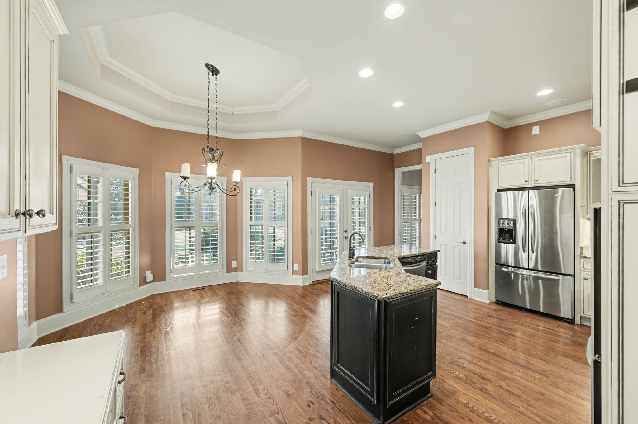 405 Luna Court Franklin, TN 37064 - Photo 20 of 57 a open kitchen with stainless steel appliances granite countertop a refrigerator a sink dishwasher a stove and a refrigerator with wooden floor