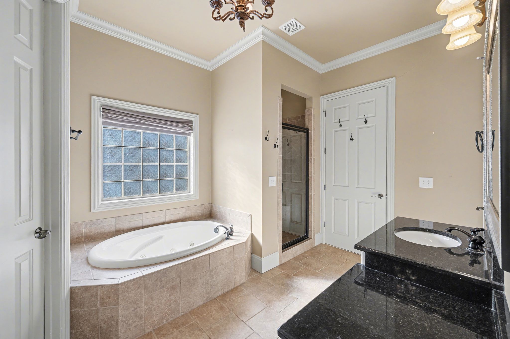 405 Luna Court Franklin, TN 37064 - Photo 30 of 57 a bathroom with a granite countertop sink and mirror with bathtub