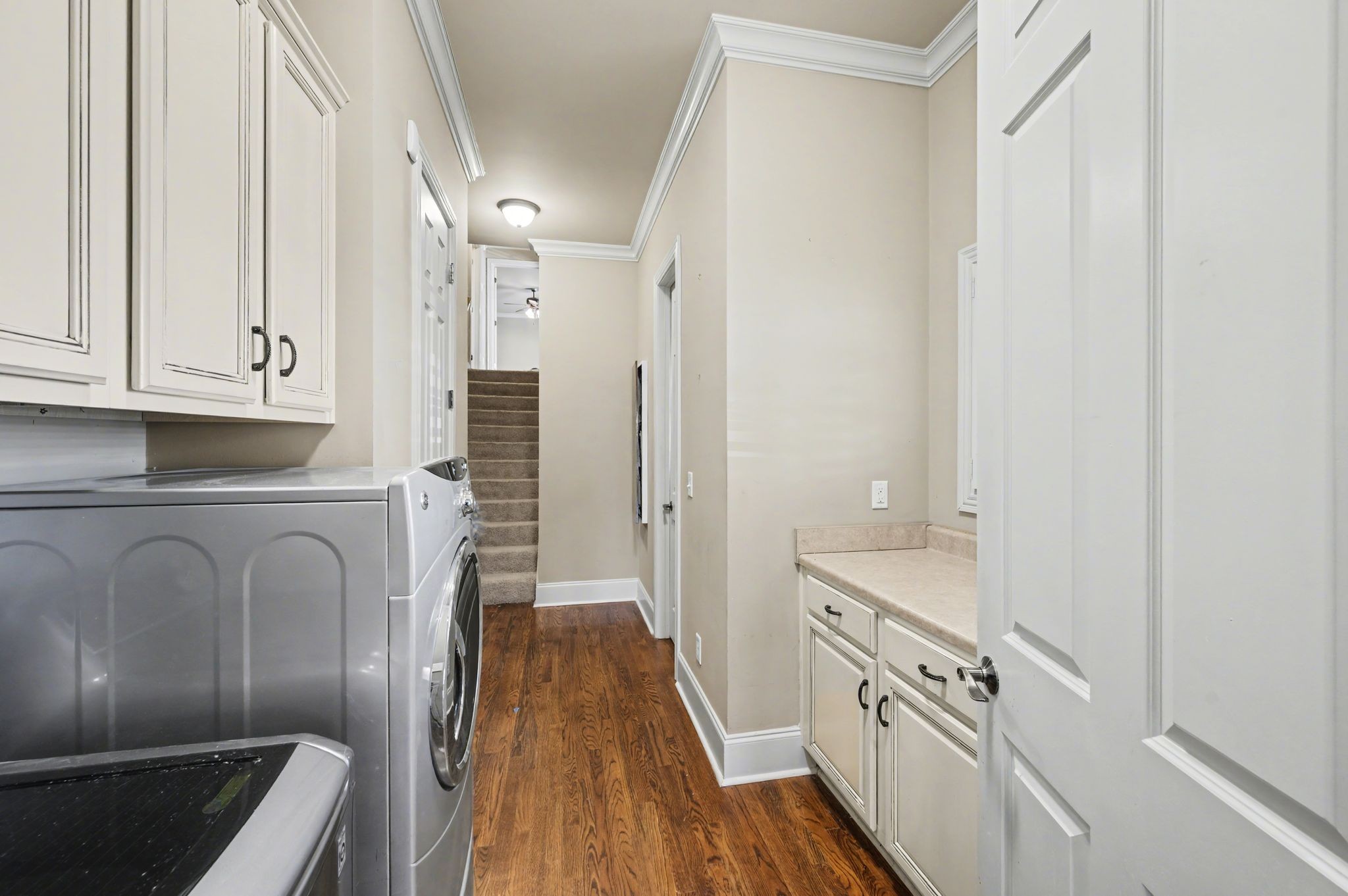 405 Luna Court Franklin, TN 37064 - Photo 37 of 57 a kitchen with white cabinets and stainless steel appliances