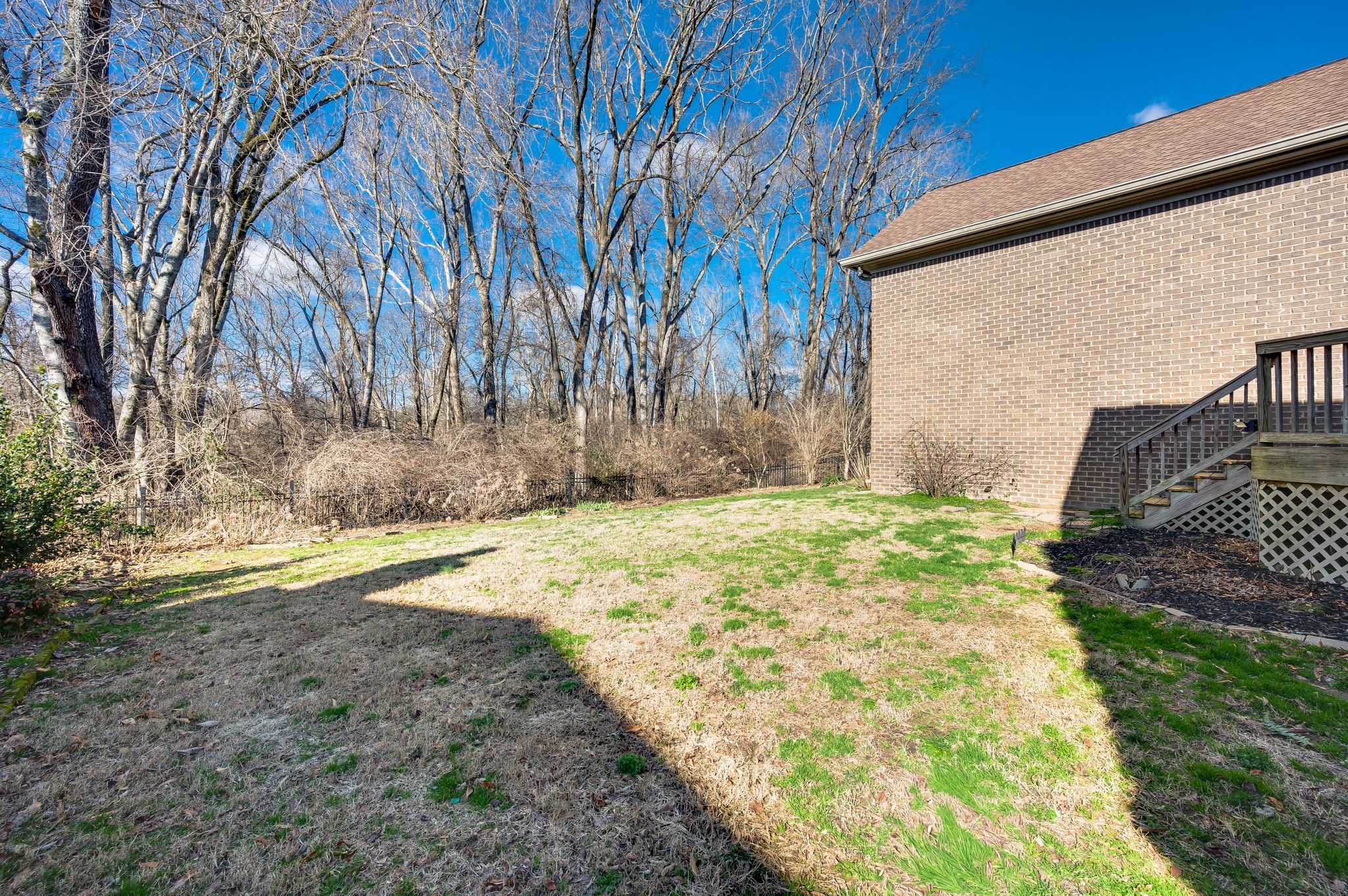 405 Luna Court Franklin, TN 37064 - Photo 50 of 57 a backyard of a house with large trees