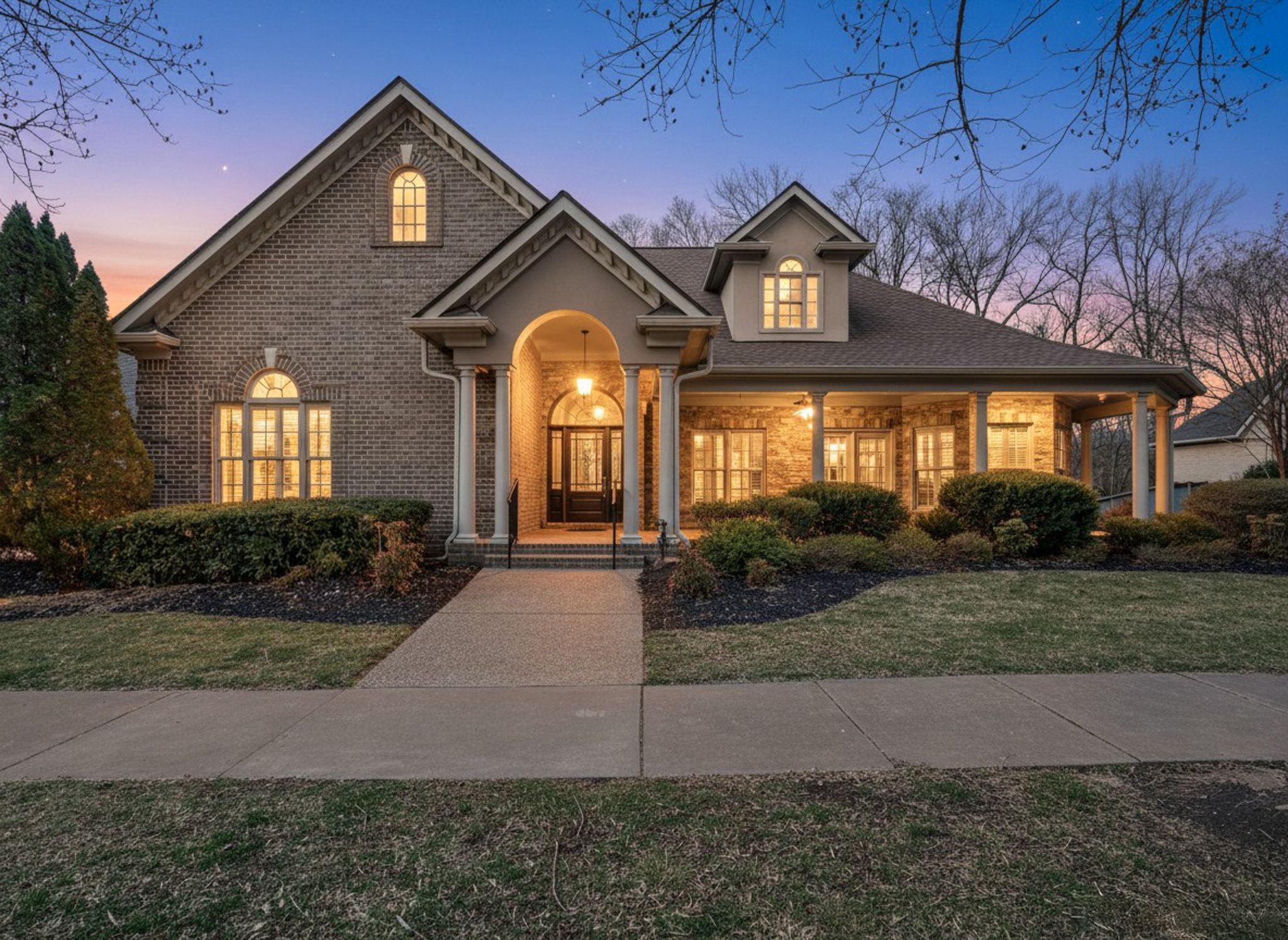 405 Luna Court Franklin, TN 37064 - Photo 7 of 57 a front view of a house with garden
