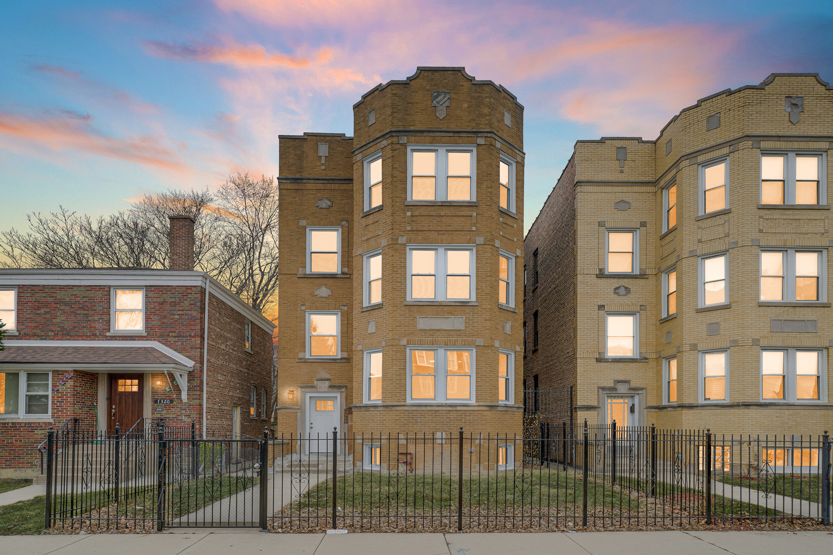 7316 South Rockwell Street, Unit 2 Chicago, IL 60629 - Photo 3 of 9 a front view of a residential apartment building with a yard