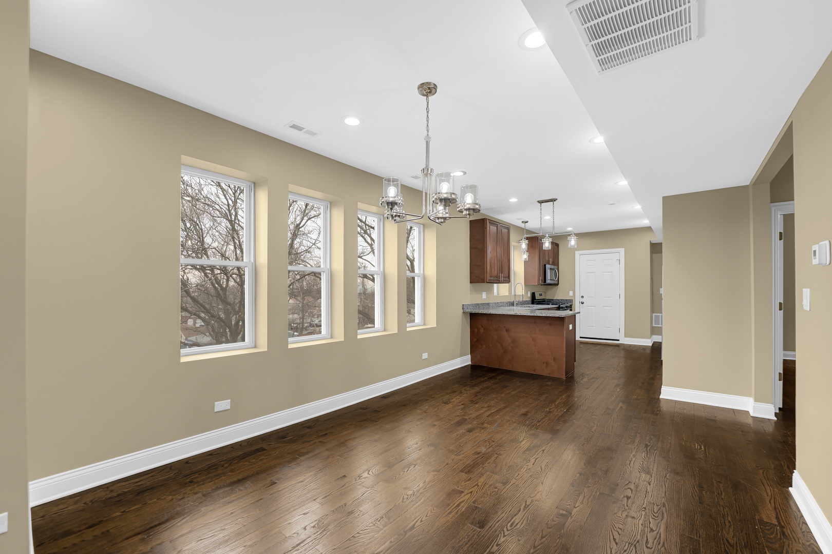 7316 South Rockwell Street, Unit 2 Chicago, IL 60629 - Photo 5 of 9 a open kitchen with window and wooden floor