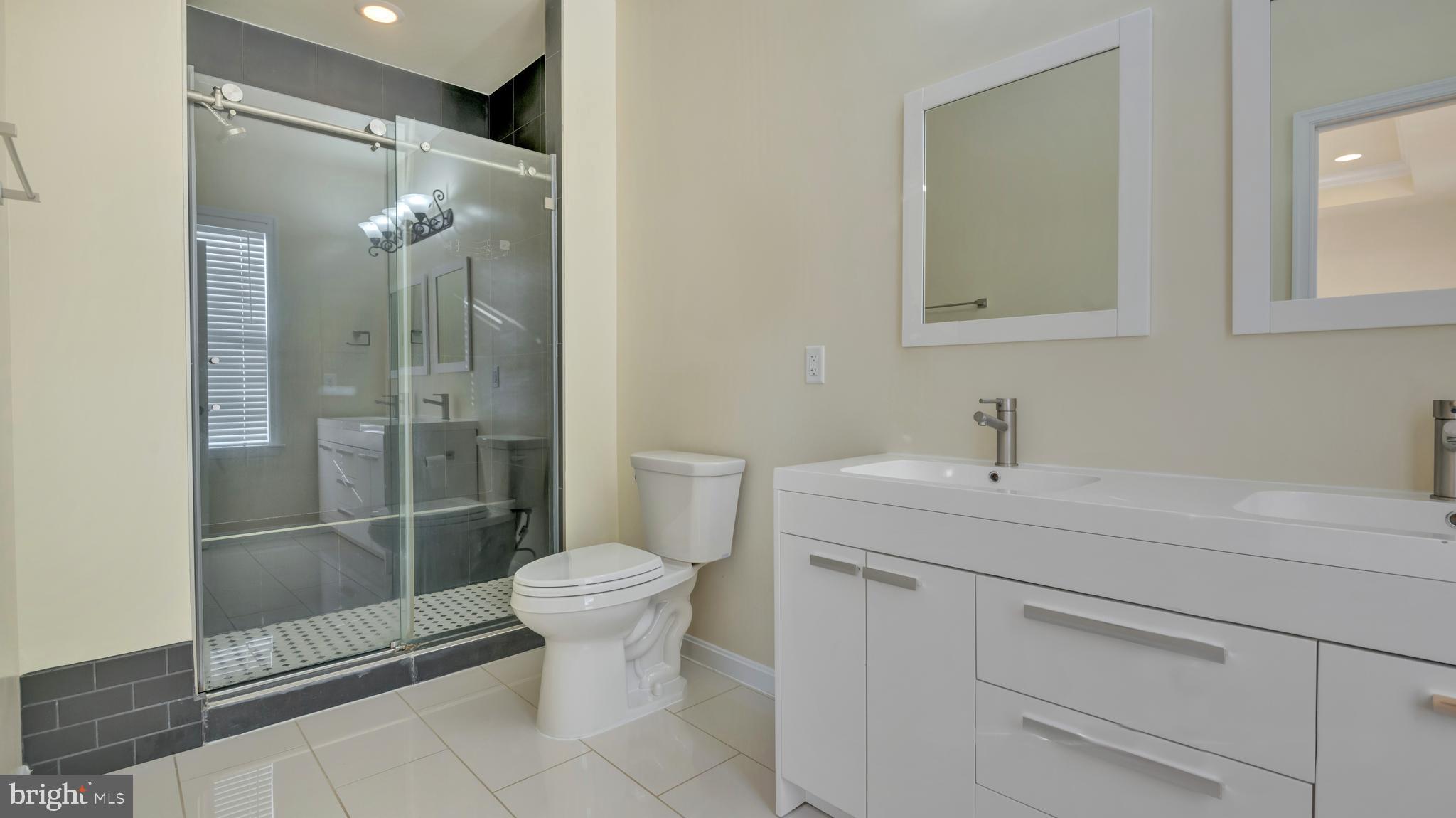 1337 Maple View Place Southeast Washington, DC 20020 - Photo 14 of 27 a bathroom with a sink toilet and shower