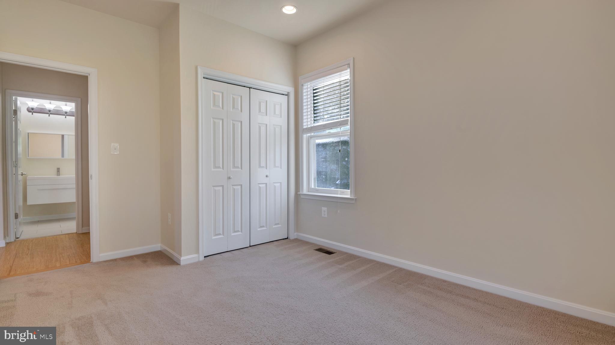 1337 Maple View Place Southeast Washington, DC 20020 - Photo 16 of 27 an empty room with windows