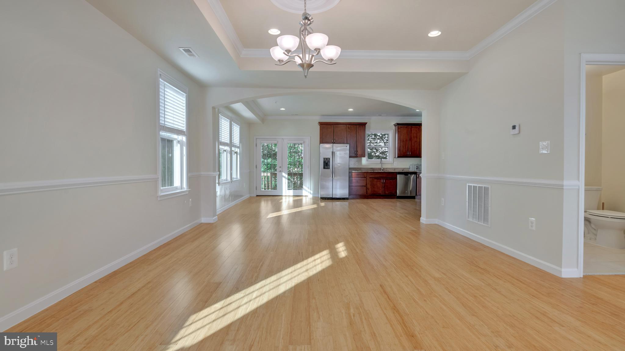 1337 Maple View Place Southeast Washington, DC 20020 - Photo 4 of 27 a view of living room with kitchen island furniture and a chandelier