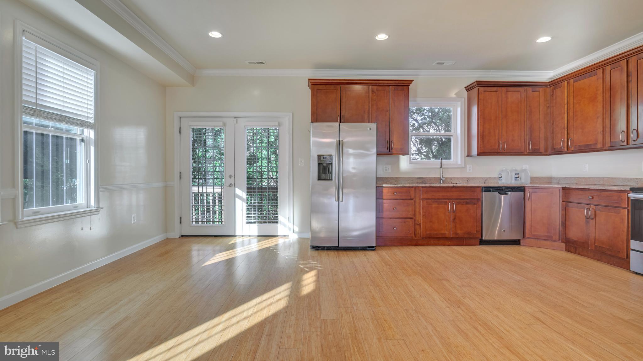 1337 Maple View Place Southeast Washington, DC 20020 - Photo 5 of 27 a view of a kitchen with wooden floor and staircase
