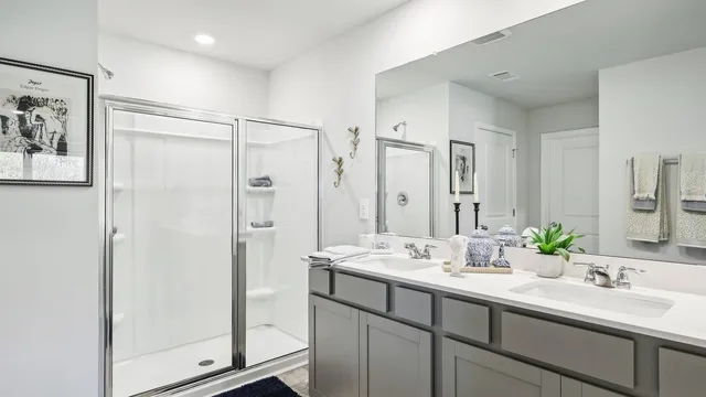 a bathroom with a double vanity sink mirror and double