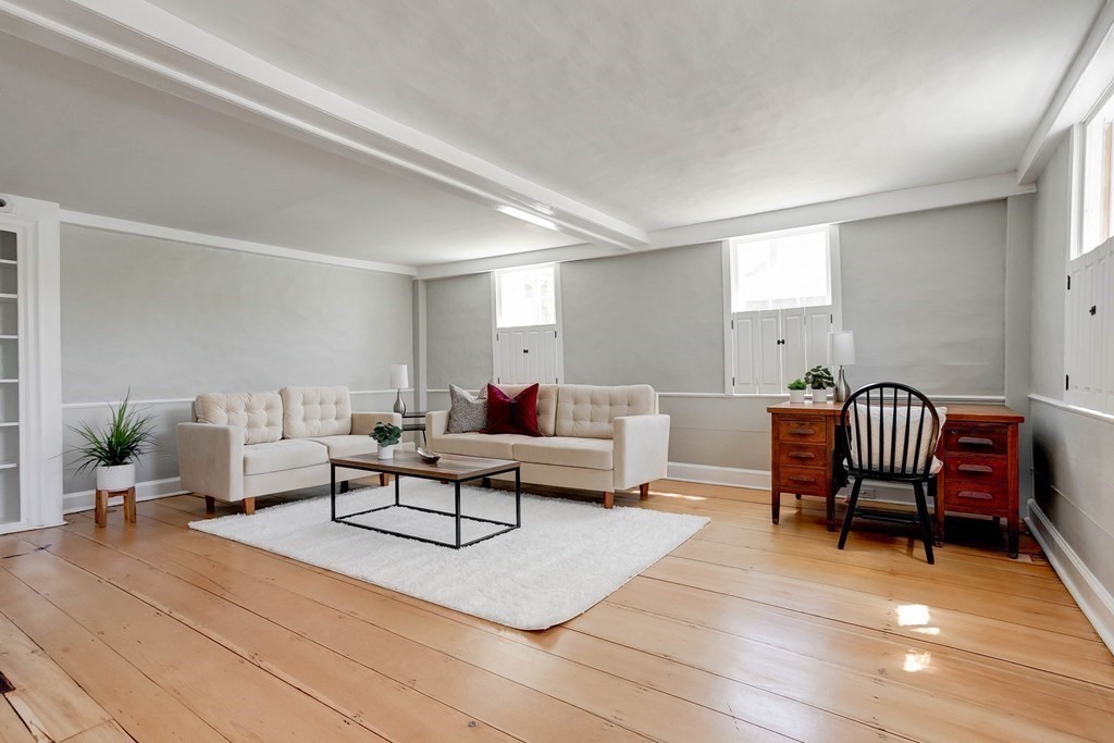7 Lexington Road Concord, MA 01742 - Photo 16 of 42 a living room with furniture and a rug