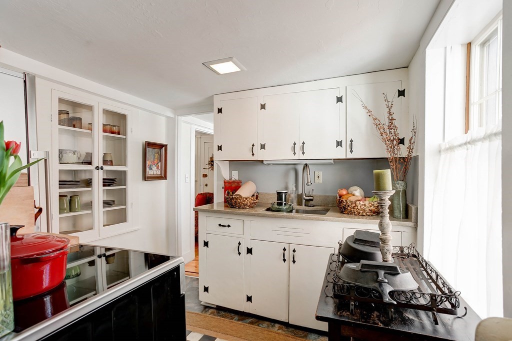 7 Lexington Road Concord, MA 01742 - Photo 28 of 42 a kitchen with stainless steel appliances a stove a sink and cabinets
