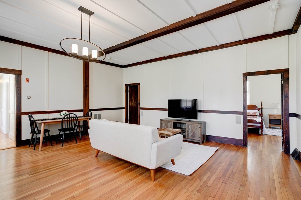 7 Lexington Road Concord, MA 01742 - Photo 32 of 42 a living room with furniture and a flat screen tv