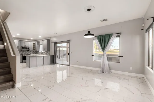 a view of kitchen with furniture and window