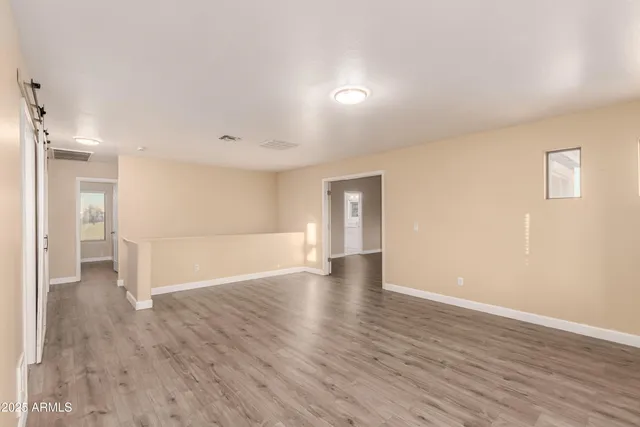 a view of a livingroom with wooden floor