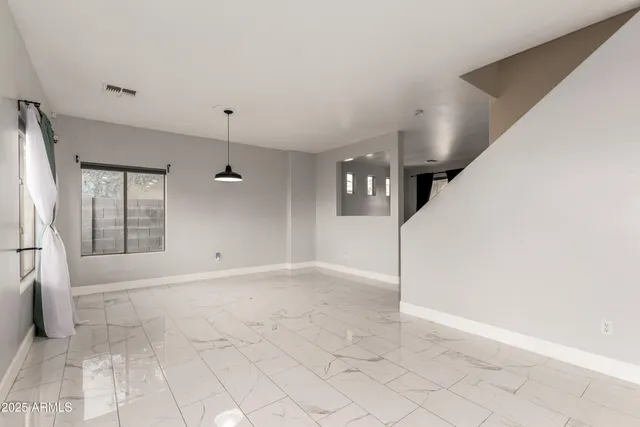 a view of a livingroom with a staircase