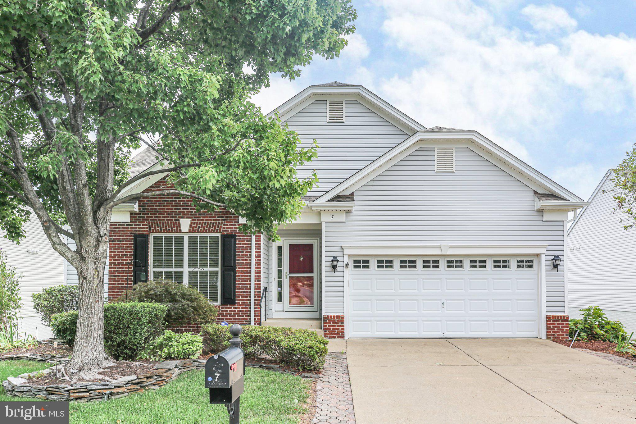 7 Carson Drive Fredericksburg, VA 22406 - Photo 1 of 51 a front view of a house with a garden and plants