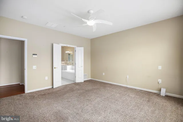 a view of an empty room with a bathroom