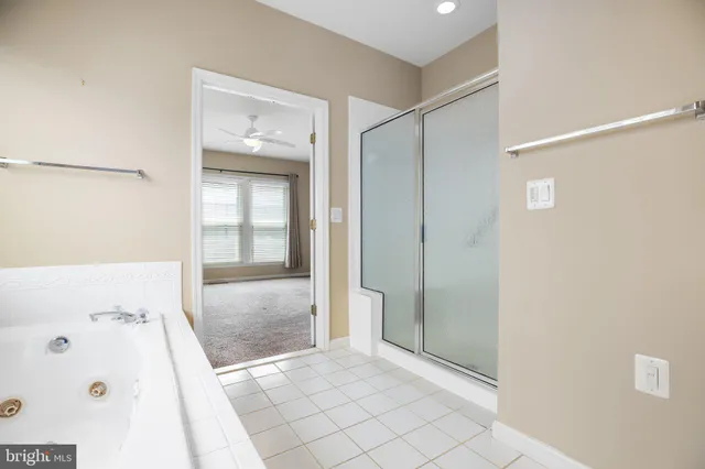 a view of a bathroom with a glass shower door