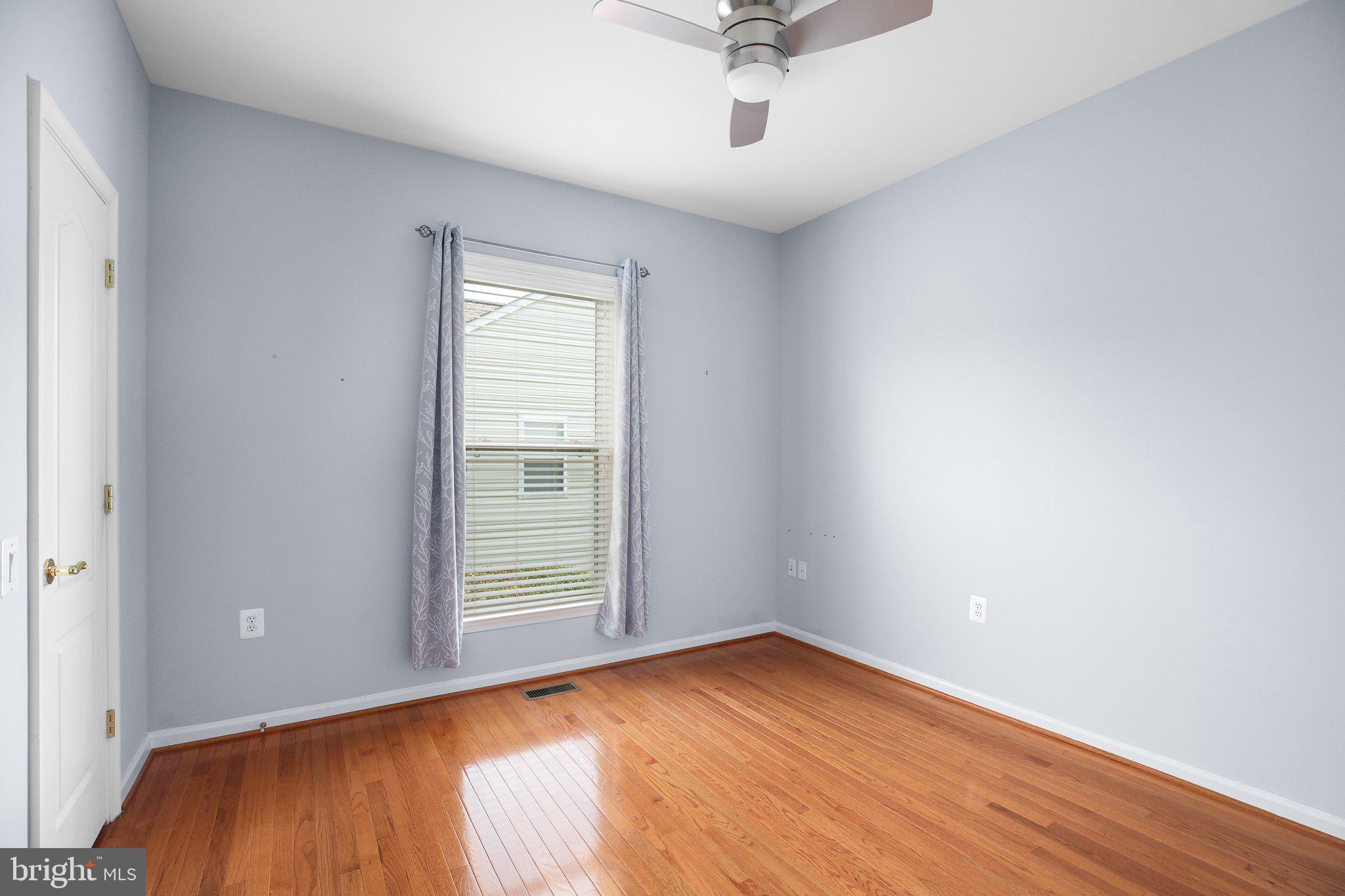 7 Carson Drive Fredericksburg, VA 22406 - Photo 10 of 51 wooden floor in an empty room with a window