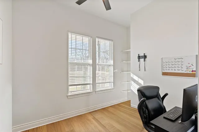 a view of a dining room and a kitchen with a table chairs