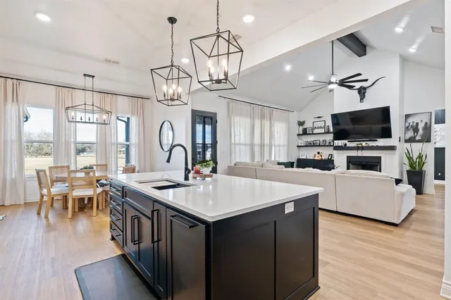 a very nice looking room with a big room and wooden floor