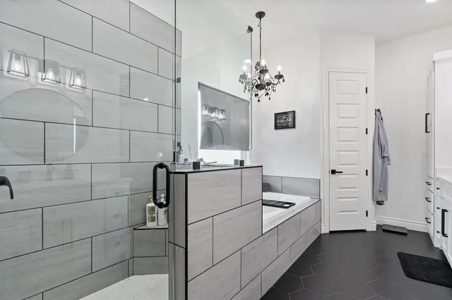 a view of hallway with cabinets and wooden floor