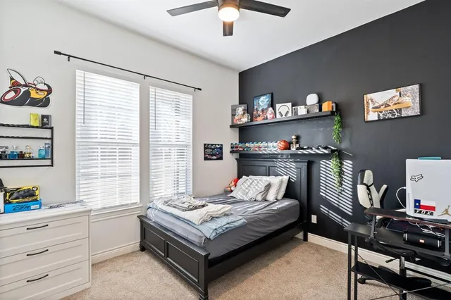 a bathroom with double vanity and a mirror