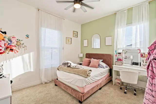 a view of a porch with furniture and a yard