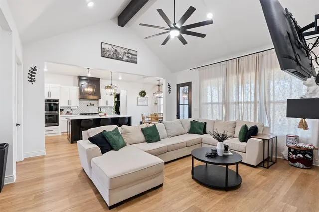 a living room with furniture fireplace and a flat screen tv