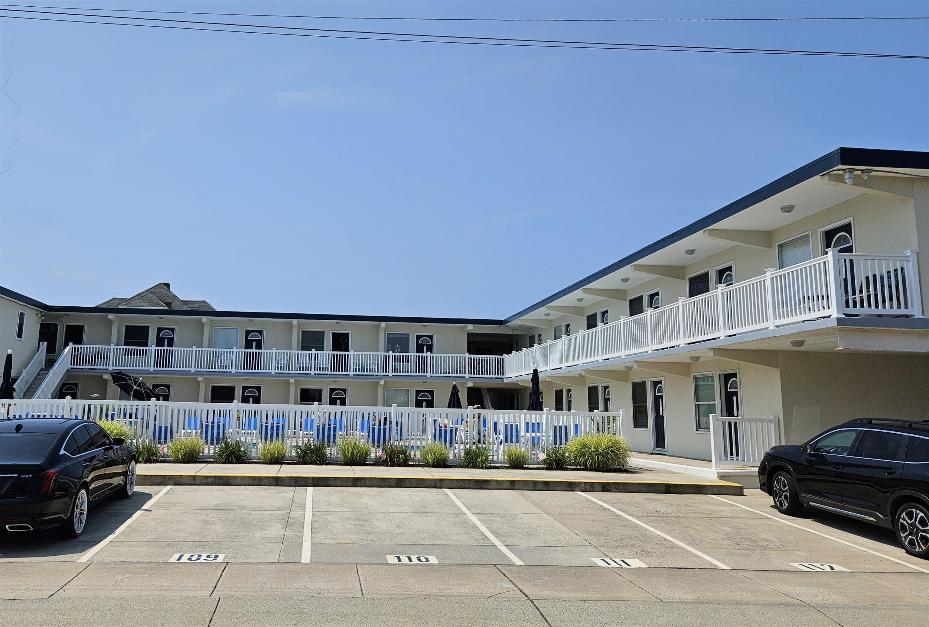 208 East Forget-Me-Not Road, Unit 111 Wildwood Crest, NJ 08260 - Photo 2 of 16 a view of a building with car parked