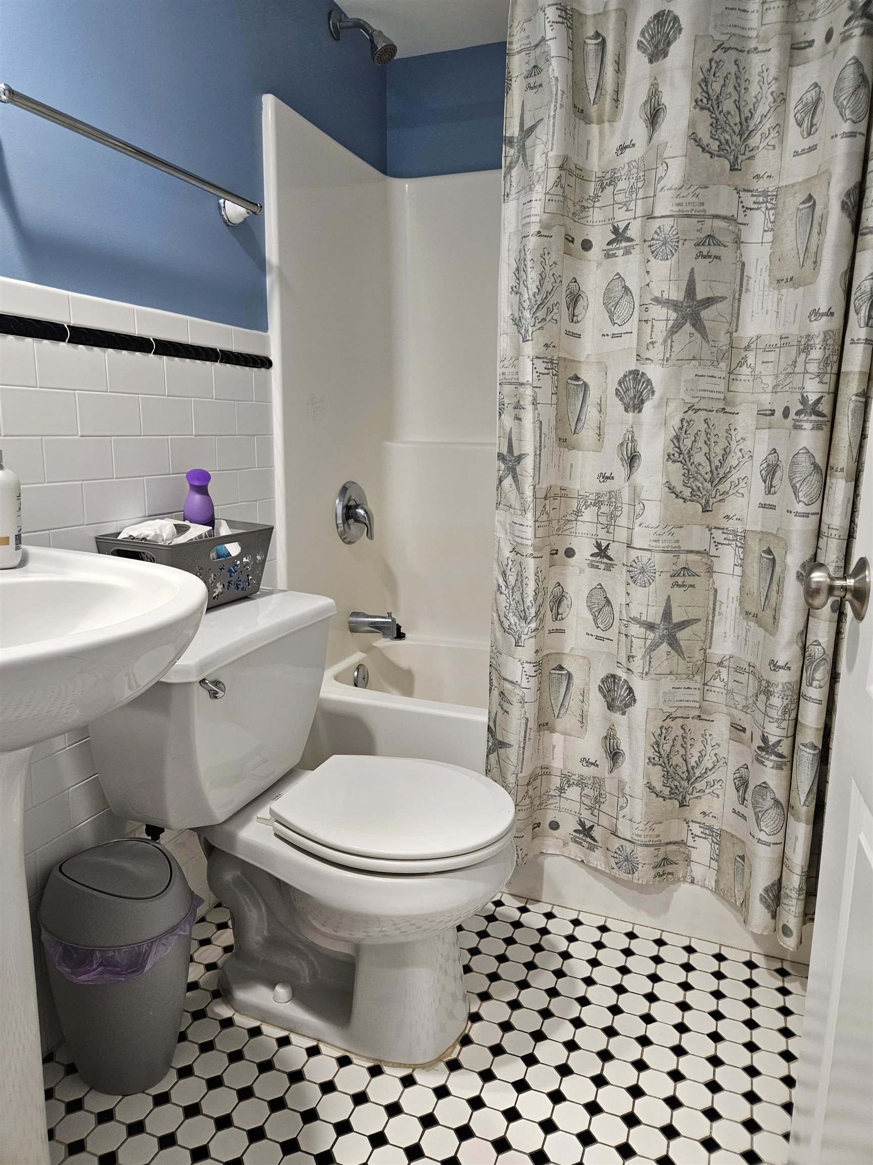 208 East Forget-Me-Not Road, Unit 111 Wildwood Crest, NJ 08260 - Photo 9 of 16 a bathroom with a toilet and a shower curtain