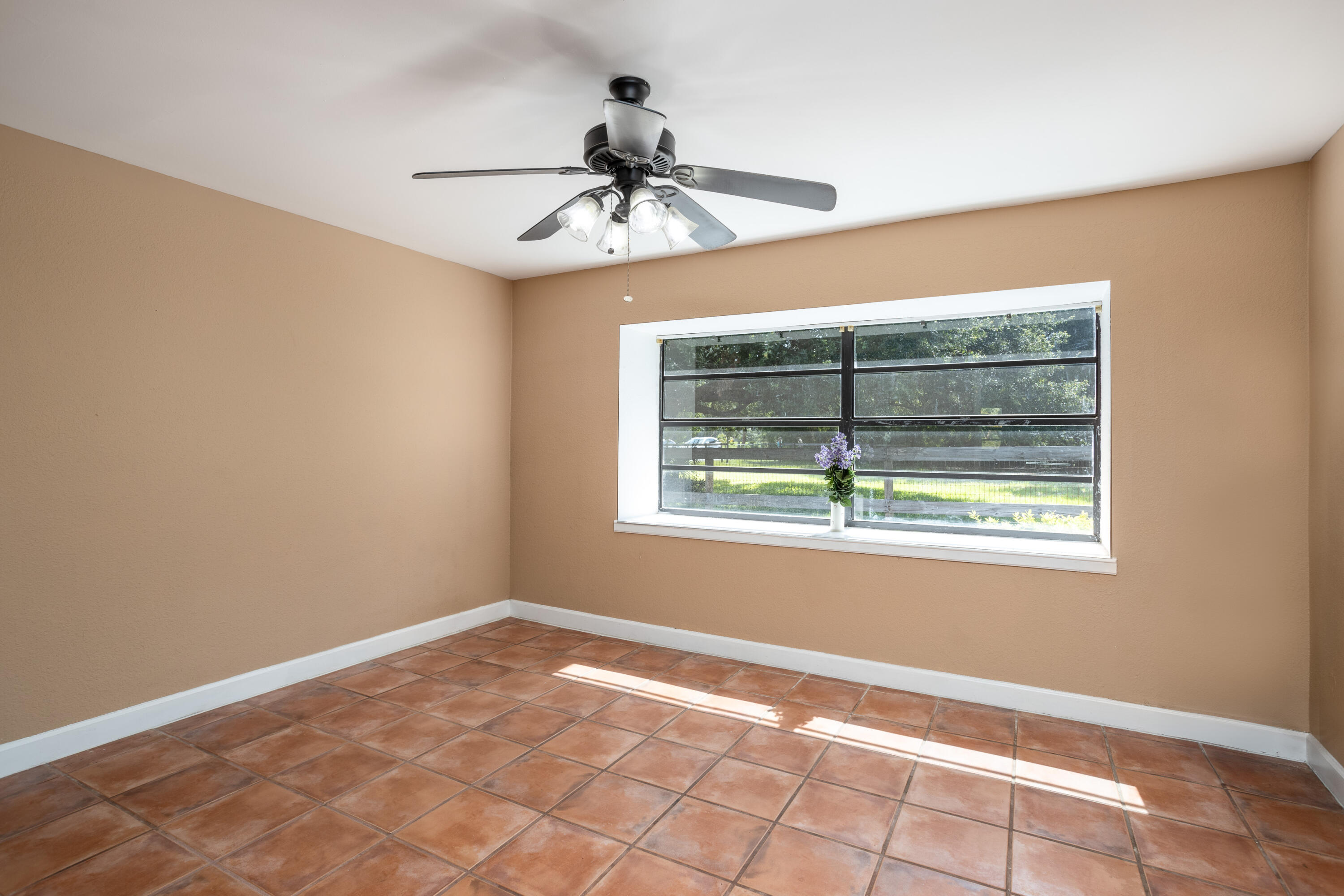 1280 Corey Road Malabar, FL 32950 - Photo 18 of 56 a view of an empty room with a window