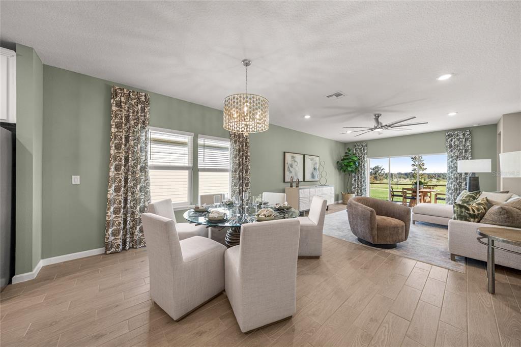 8904 Southwest 69th Terrace Ocala, FL 34476 - Photo 17 of 26 a living room with furniture and a large window