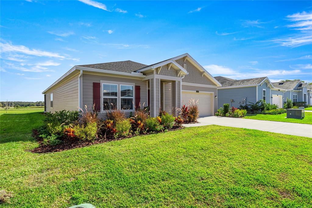 8904 Southwest 69th Terrace Ocala, FL 34476 - Photo 2 of 26 a front view of house with yard and green space