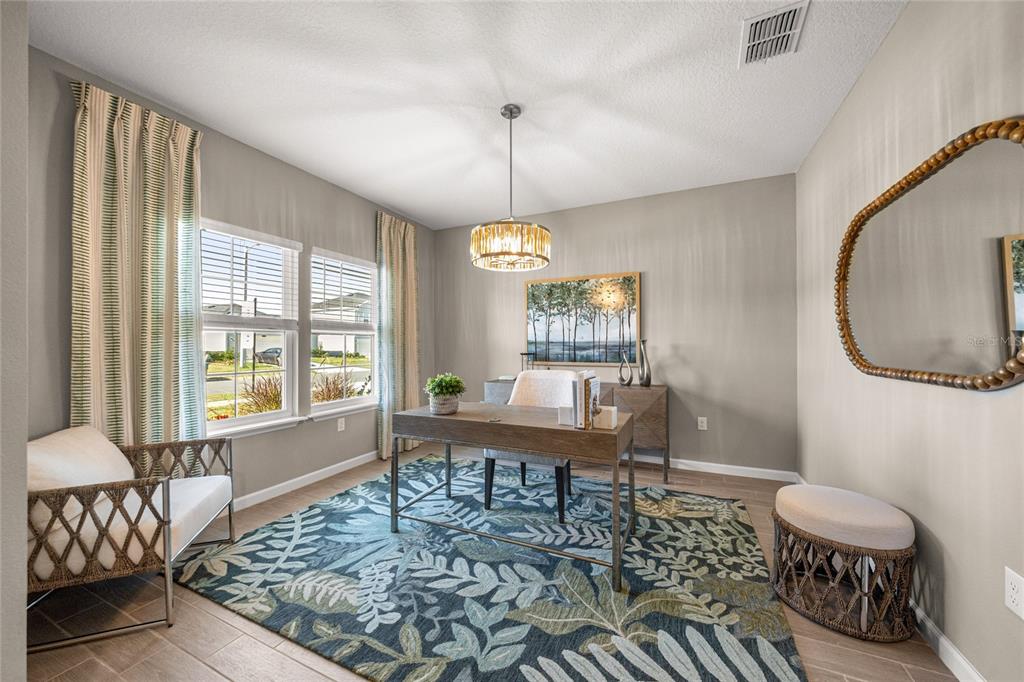 8904 Southwest 69th Terrace Ocala, FL 34476 - Photo 25 of 26 a living room with furniture and a window