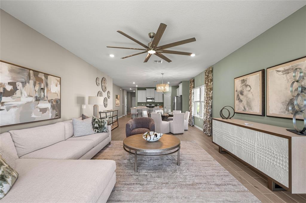 8904 Southwest 69th Terrace Ocala, FL 34476 - Photo 26 of 26 a living room with furniture and a large window