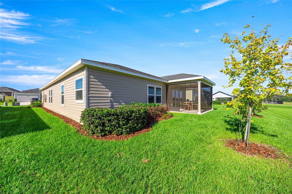 8904 Southwest 69th Terrace Ocala, FL 34476 - Photo 3 of 26 a view of a house with a yard