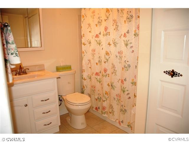 1505 Regency Woods Road, Unit 101 101 Henrico, VA 23238 - Photo 10 of 12 Master Bath - Master bath with ceramic tile floor and laundry area with stack washer/dryer that convey