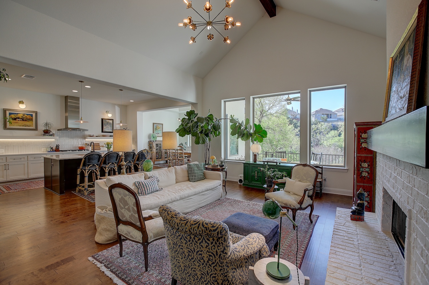 Open, spacious and luxuriously appointed. Like an aerie perch. You're high above the ground and the views are delightful, with no direct back neighbors.