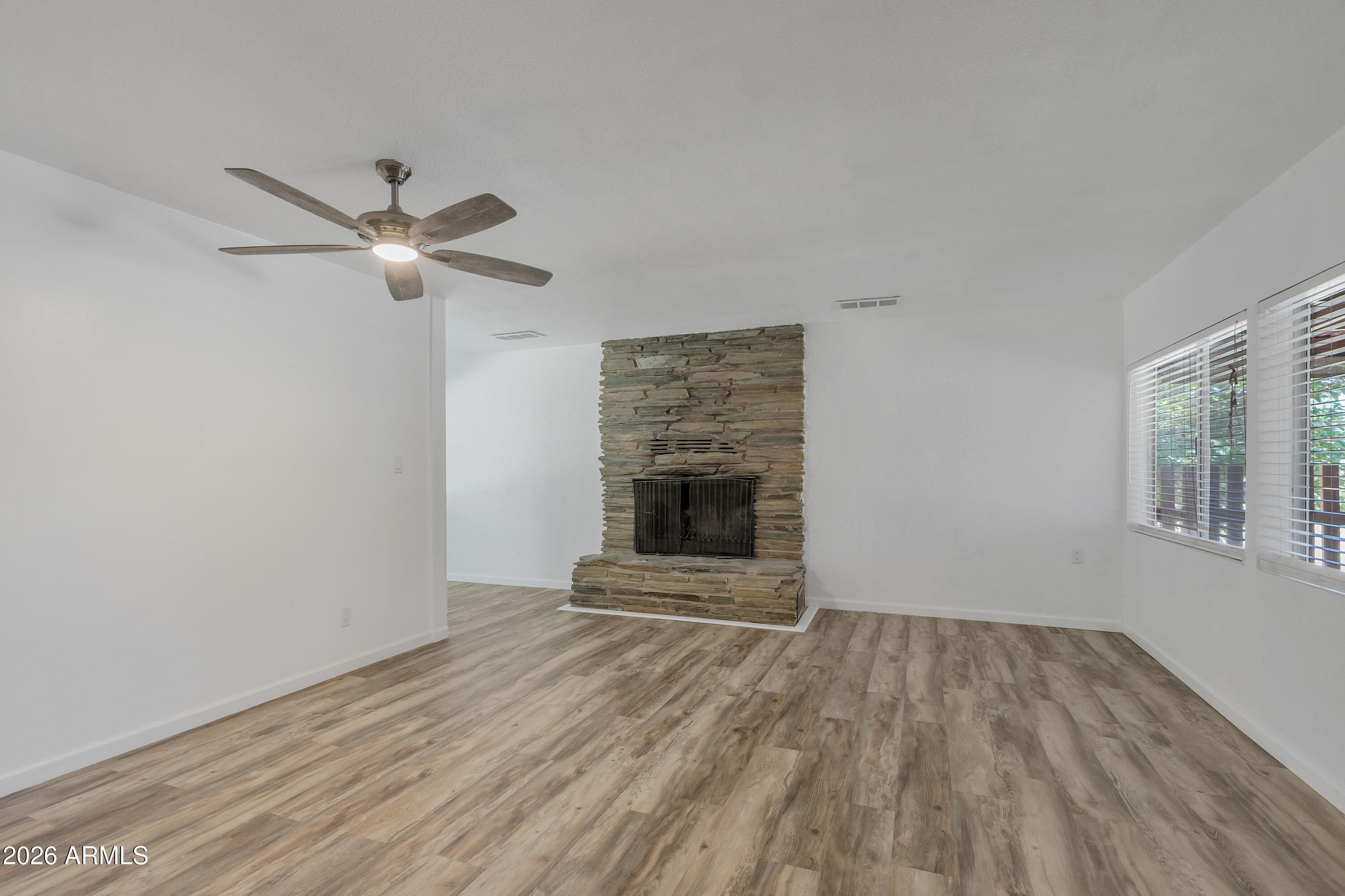 4410 North Montezuma Avenue Rimrock, AZ 86335 - Photo 15 of 27 Primary bedroom with fireplace