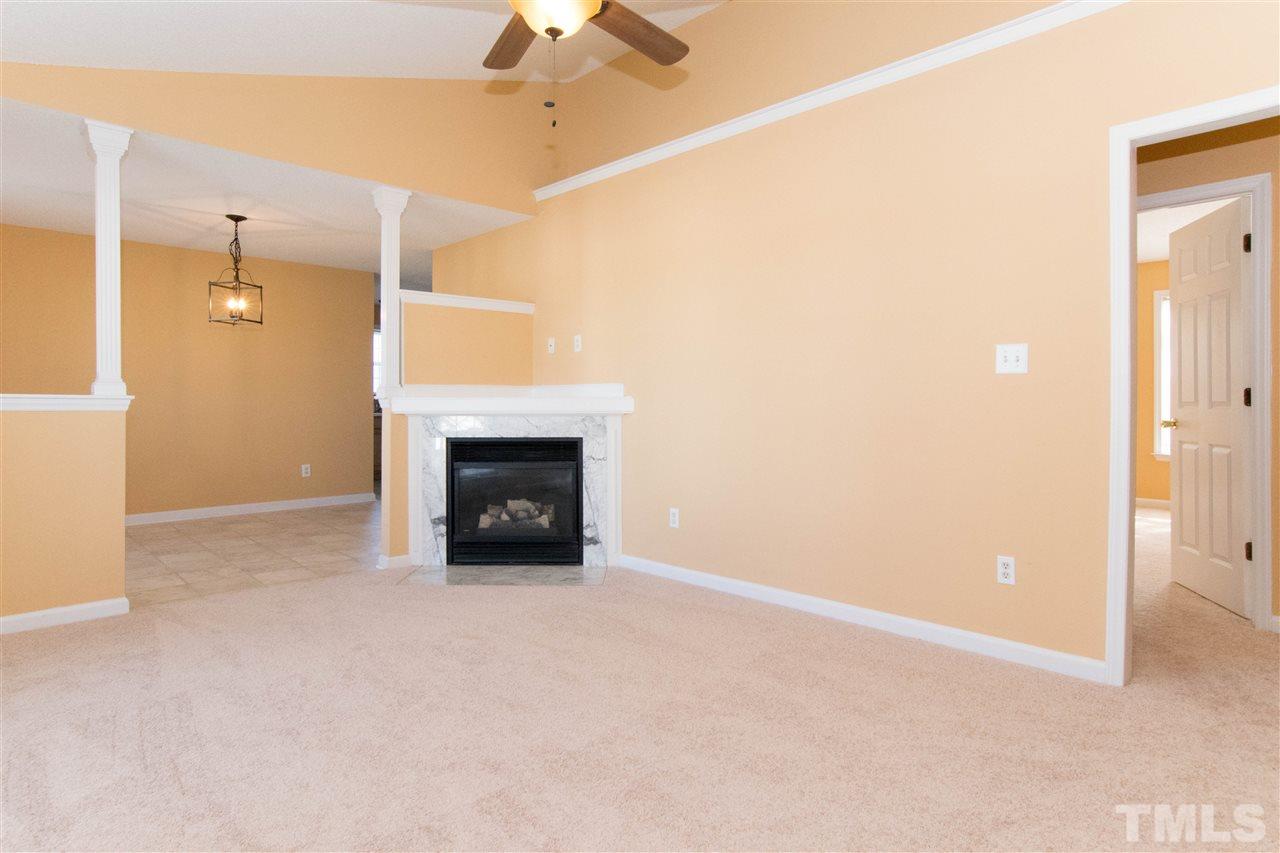 7112 Spanglers Spring Way Raleigh, NC 27610 - Photo 1 of 19 a view of empty room with a fireplace